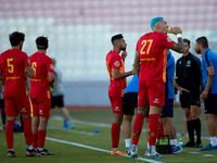 Birkirkara soccer players refresh themselves during a cooling break at the Malta 360 Sports Premier League soccer match between Hibernians a...