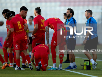 Stefano De Angelis, head coach of Birkirkara, speaks to his players during a cooling break at the Malta 360 Sports Premier League soccer mat...