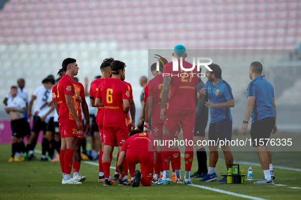 Birkirkara soccer players refresh themselves during a cooling break at the Malta 360 Sports Premier League soccer match between Hibernians a...