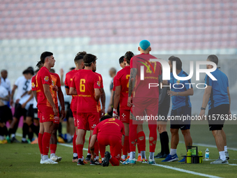 Birkirkara soccer players refresh themselves during a cooling break at the Malta 360 Sports Premier League soccer match between Hibernians a...