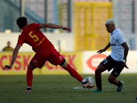 In Ta' Qali, Malta, on September 14, 2024, Alex Bruno de Souza Silva (R) of Hibernians competes for the ball with Augustin Sandona (L) of Bi...