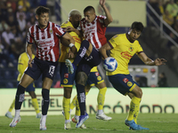 Roberto Alvarado #25 of Chivas de Guadalajara and Nestor Araujo #14 of America during the 17th round match of the Torneo de Apertura as part...