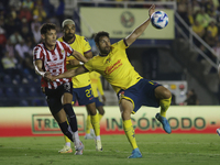 Jesus Orozco #13 of Chivas de Guadalajara and Nestor Araujo #14 of America during the 17th round match of the Torneo de Apertura as part of...