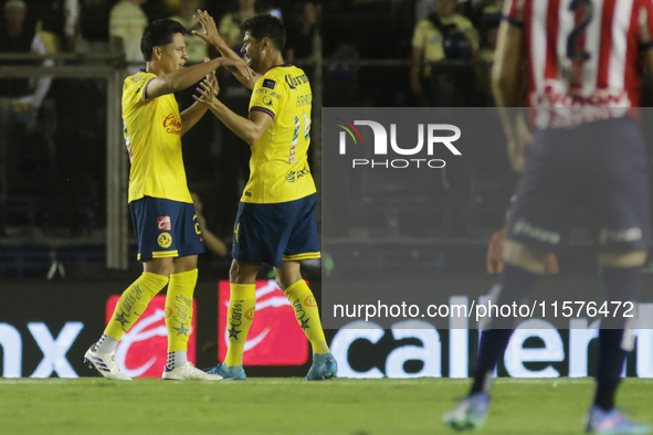 Ramon Juarez Del Castillo #29 and Nestor Araujo #14 of America celebrate after scoring a goal during the 17th round match of the Torneo de A...