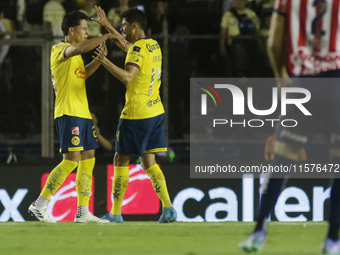 Ramon Juarez Del Castillo #29 and Nestor Araujo #14 of America celebrate after scoring a goal during the 17th round match of the Torneo de A...