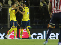 Ramon Juarez Del Castillo #29 and Nestor Araujo #14 of America celebrate after scoring a goal during the 17th round match of the Torneo de A...