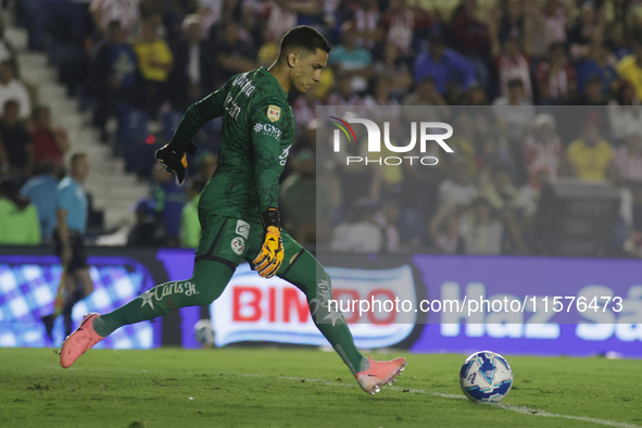 Goalkeeper Luis Malagon #1 of America shoots the ball during the 17th round match of the Torneo de Apertura as part of the Liga MX between C...