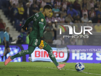 Goalkeeper Luis Malagon #1 of America shoots the ball during the 17th round match of the Torneo de Apertura as part of the Liga MX between C...