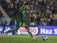 Goalkeeper Luis Malagon #1 of America shoots the ball during the 17th round match of the Torneo de Apertura as part of the Liga MX between C...