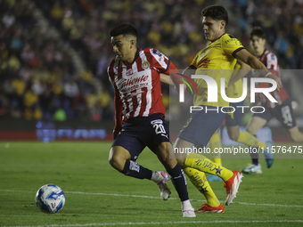 Fernando Beltran Cruz #20 of Chivas de Guadalajara drives the ball forward during the 17th round match of the Torneo de Apertura as part of...