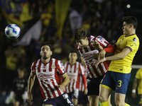 Armando Gonzalez Alba #34 of Chivas de Guadalajara heads the ball during the 17th round match of the Torneo de Apertura as part of the Liga...