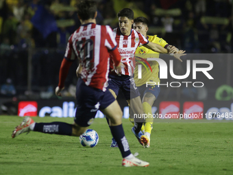 Jose Castillo Perez #21 of Chivas de Guadalajara drives the ball forward during the 17th round match of the Torneo de Apertura as part of th...