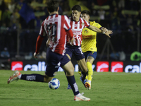 Jose Castillo Perez #21 of Chivas de Guadalajara drives the ball forward during the 17th round match of the Torneo de Apertura as part of th...