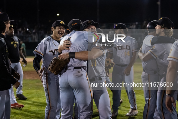 The Yolo High Wheelers celebrate advancing to the Pioneer Baseball League's championship series with their 6 to 4 win over the Oakland Balle...