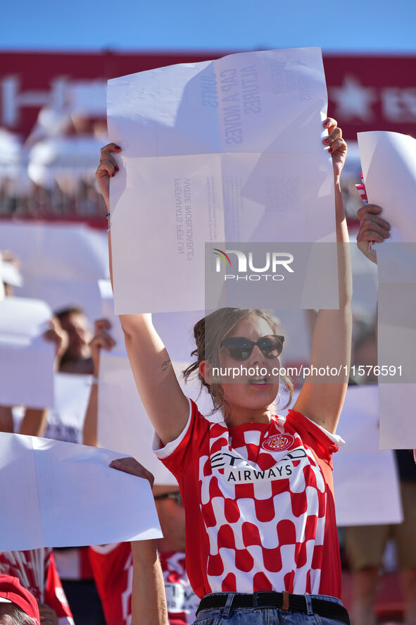 Girona fans cheer for their team during the La Liga EA SPORTS match against FC Barcelona at Estadi Montilivi, in Girona, Spain, on September...