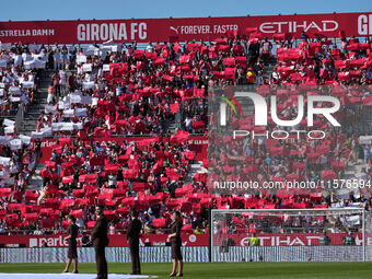 Girona fans cheer for their team during the La Liga EA SPORTS match against FC Barcelona at Estadi Montilivi, in Girona, Spain, on September...