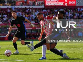 David Lopez of Girona clears the ball from danger during the La Liga EA SPORTS match against FC Barcelona at Estadi Montilivi in Girona, Spa...