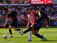 David Lopez of Girona clears the ball from danger during the La Liga EA SPORTS match against FC Barcelona at Estadi Montilivi in Girona, Spa...