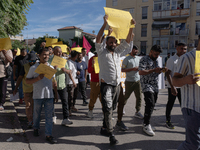 Immigrant communities in the Naples area stage a procession in Grumo Nevano, Italy, on Sunday against recent attacks on their members. ''Eno...