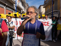 Immigrant communities in the Naples area stage a procession in Grumo Nevano, Italy, on Sunday against recent attacks on their members. ''Eno...