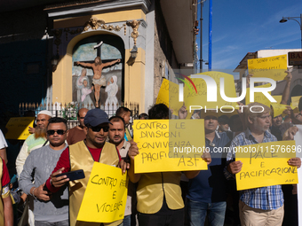 Immigrant communities in the Naples area stage a procession in Grumo Nevano, Italy, on Sunday against recent attacks on their members. ''Eno...