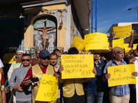 Immigrant communities in the Naples area stage a procession in Grumo Nevano, Italy, on Sunday against recent attacks on their members. ''Eno...