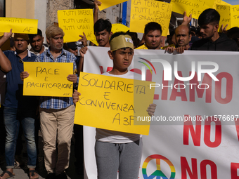 Immigrant communities in the Naples area stage a procession in Grumo Nevano, Italy, on Sunday against recent attacks on their members. ''Eno...