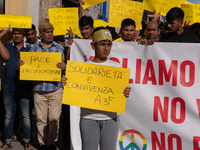 Immigrant communities in the Naples area stage a procession in Grumo Nevano, Italy, on Sunday against recent attacks on their members. ''Eno...