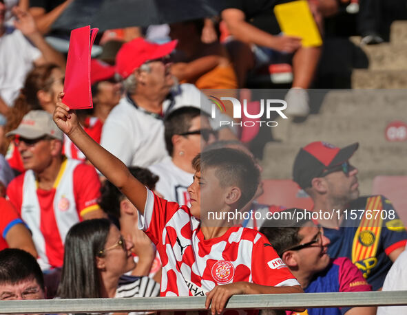 Girona fans cheer for their team during the La Liga EA SPORTS match against FC Barcelona at Estadi Montilivi, in Girona, Spain, on September...