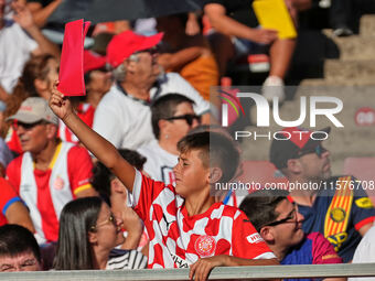 Girona fans cheer for their team during the La Liga EA SPORTS match against FC Barcelona at Estadi Montilivi, in Girona, Spain, on September...