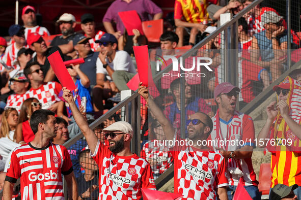 Girona fans cheer for their team during the La Liga EA SPORTS match against FC Barcelona at Estadi Montilivi, in Girona, Spain, on September...