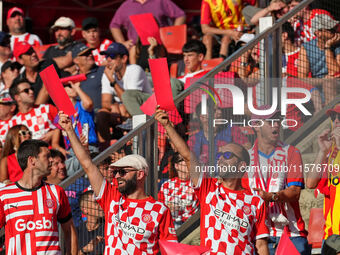 Girona fans cheer for their team during the La Liga EA SPORTS match against FC Barcelona at Estadi Montilivi, in Girona, Spain, on September...