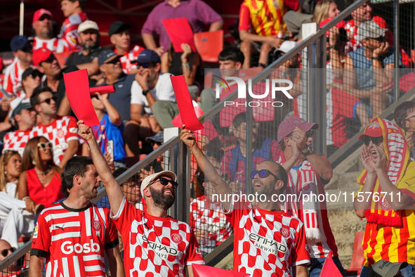 Girona fans cheer for their team during the La Liga EA SPORTS match against FC Barcelona at Estadi Montilivi, in Girona, Spain, on September...