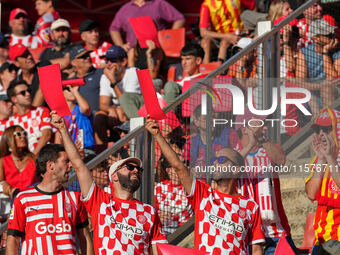 Girona fans cheer for their team during the La Liga EA SPORTS match against FC Barcelona at Estadi Montilivi, in Girona, Spain, on September...