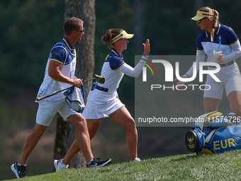 GAINESVILLE, VIRGINIA - SEPTEMBER 15: Linn Grant of Team Europe celebrates her putt on hole 11 while walking with her caddie during the fina...