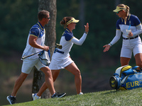 GAINESVILLE, VIRGINIA - SEPTEMBER 15: Linn Grant of Team Europe celebrates her putt on hole 11 while walking with her caddie during the fina...