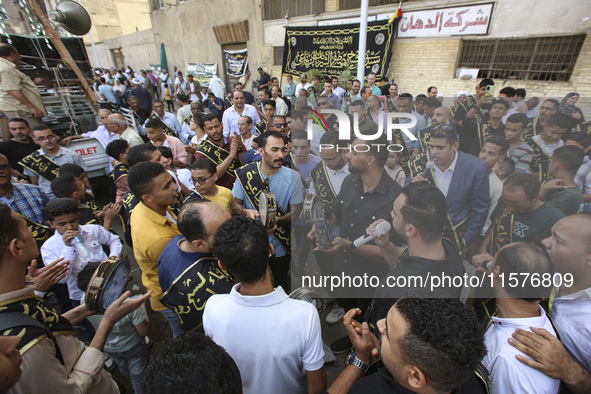 Egyptian Muslims parade to celebrate Moulid Al-Nabi, the birthday of the Prophet Muhammad, in Cairo, Egypt, on September 15, 2024. 