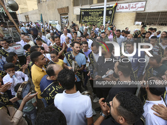 Egyptian Muslims parade to celebrate Moulid Al-Nabi, the birthday of the Prophet Muhammad, in Cairo, Egypt, on September 15, 2024. (