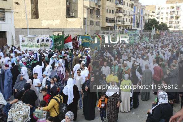 Egyptian Muslims parade to celebrate Moulid Al-Nabi, the birthday of the Prophet Muhammad, in Cairo, Egypt, on September 15, 2024. 