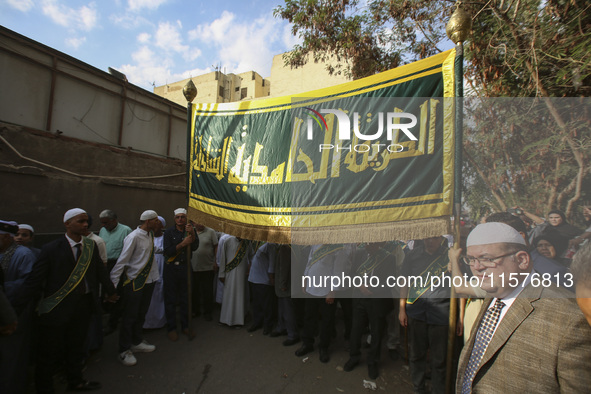 Egyptian Muslims parade to celebrate Moulid Al-Nabi, the birthday of the Prophet Muhammad, in Cairo, Egypt, on September 15, 2024. 