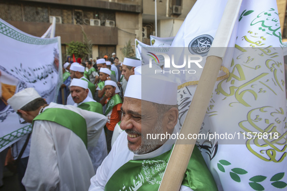 Egyptian Muslims parade to celebrate Moulid Al-Nabi, the birthday of the Prophet Muhammad, in Cairo, Egypt, on September 15, 2024. 