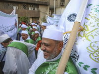 Egyptian Muslims parade to celebrate Moulid Al-Nabi, the birthday of the Prophet Muhammad, in Cairo, Egypt, on September 15, 2024. (