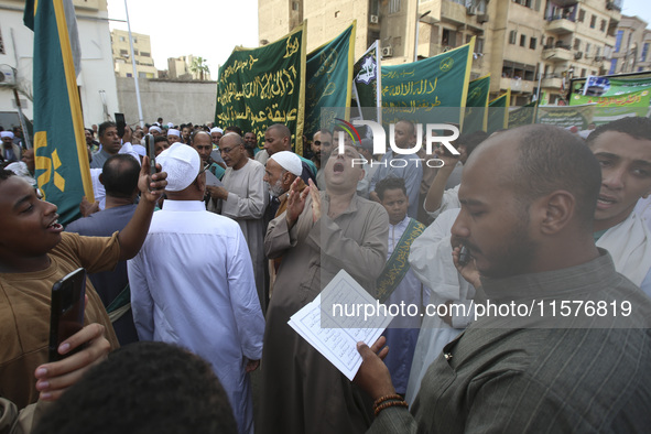 Egyptian Muslims parade to celebrate Moulid Al-Nabi, the birthday of the Prophet Muhammad, in Cairo, Egypt, on September 15, 2024. 