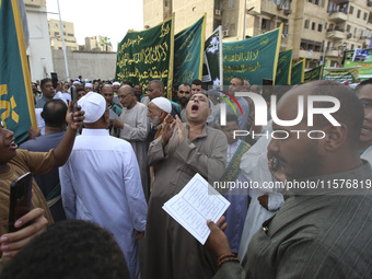 Egyptian Muslims parade to celebrate Moulid Al-Nabi, the birthday of the Prophet Muhammad, in Cairo, Egypt, on September 15, 2024. (