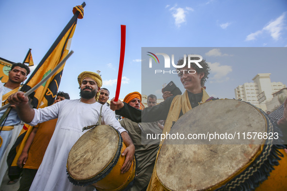 Egyptian Muslims parade to celebrate Moulid Al-Nabi, the birthday of the Prophet Muhammad, in Cairo, Egypt, on September 15, 2024. 