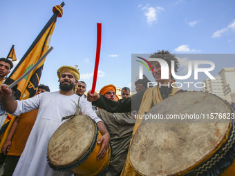 Egyptian Muslims parade to celebrate Moulid Al-Nabi, the birthday of the Prophet Muhammad, in Cairo, Egypt, on September 15, 2024. (