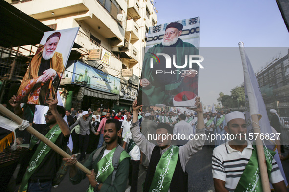 Egyptian Muslims parade to celebrate Moulid Al-Nabi, the birthday of the Prophet Muhammad, in Cairo, Egypt, on September 15, 2024. 