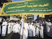 Egyptian Muslims parade to celebrate Moulid Al-Nabi, the birthday of the Prophet Muhammad, in Cairo, Egypt, on September 15, 2024. (