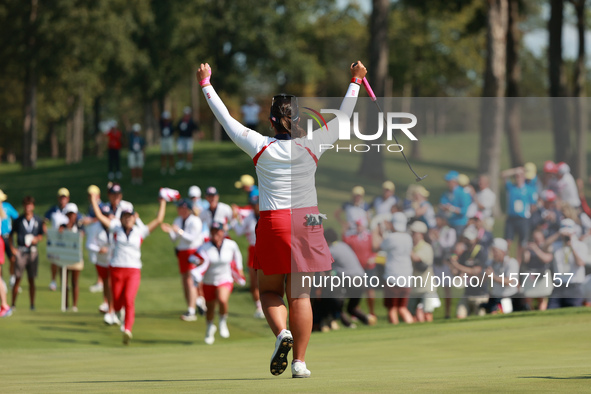 GAINESVILLE, VIRGINIA - SEPTEMBER 15: Lilia Vu of of Team USA follows her putt on the 18th green during single matches on Day Three of the S...