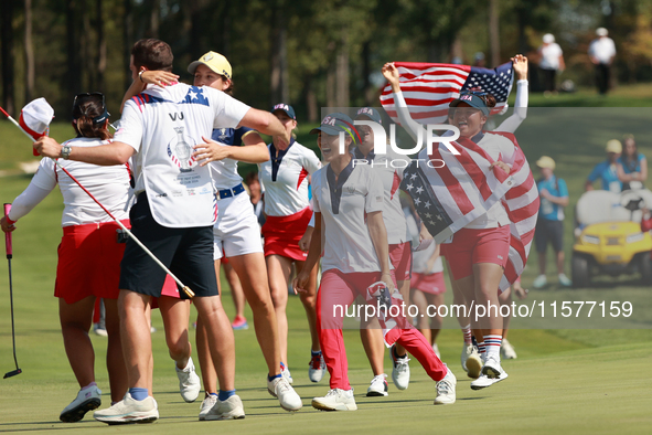 GAINESVILLE, VIRGINIA - SEPTEMBER 15: Team USA players celebrates after winning the Solheim Cup at Robert Trent Jones Golf Club on Sunday, S...